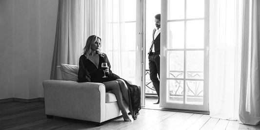  A tense moment between three characters in a luxury home, filled with subtle glances and unspoken emotions